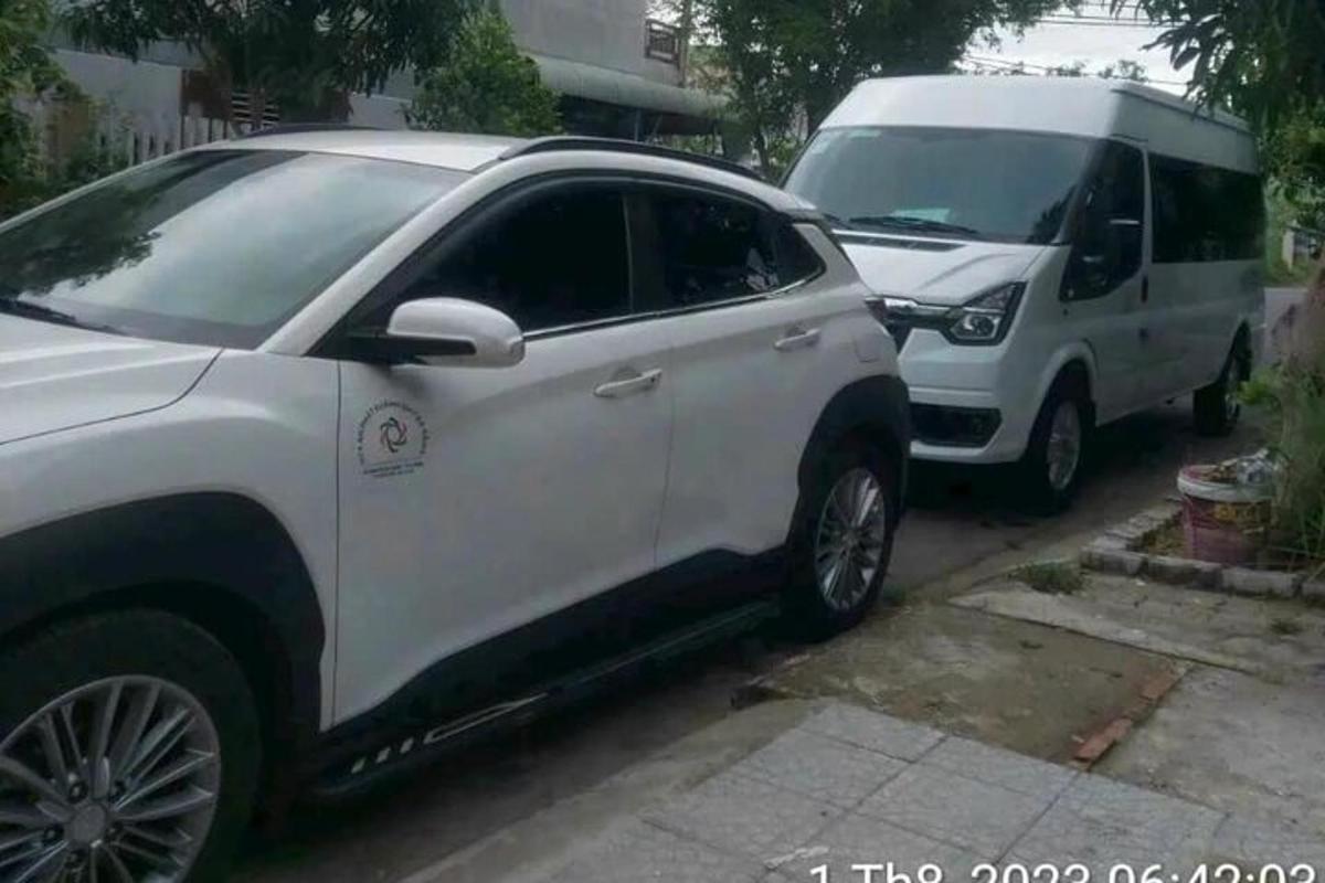 a white suv and a white van parked next to each other