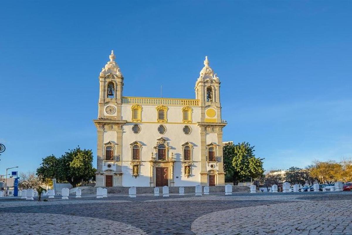 a large yellow building with a clock tower