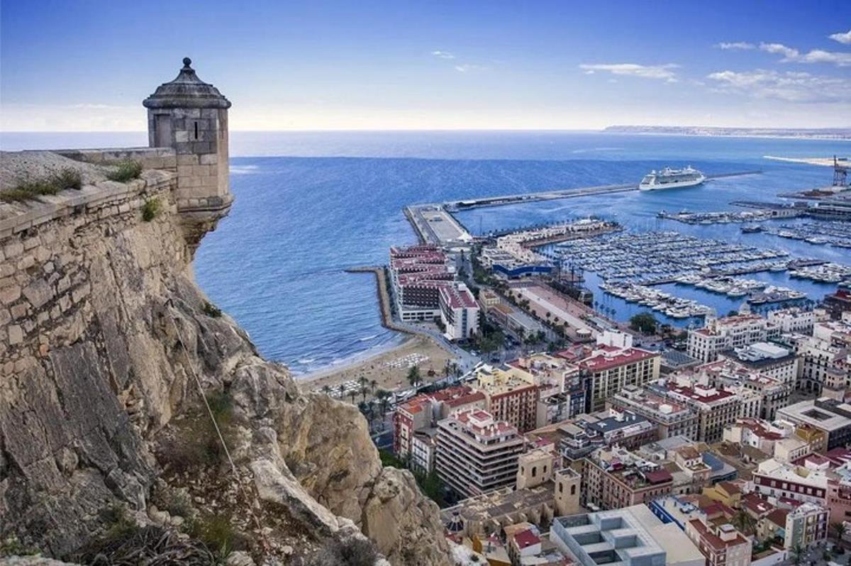 an aerial view of a city and the ocean