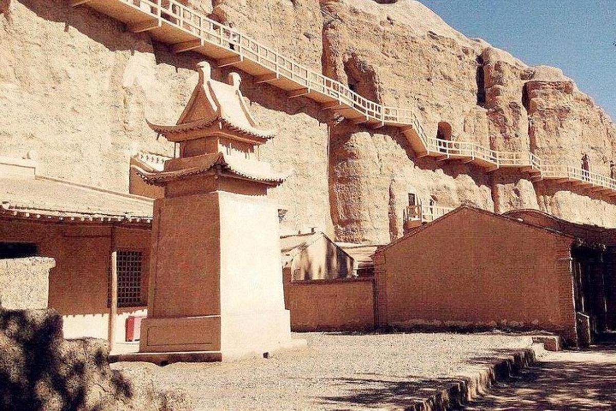 a building with a staircase on the side of a mountain
