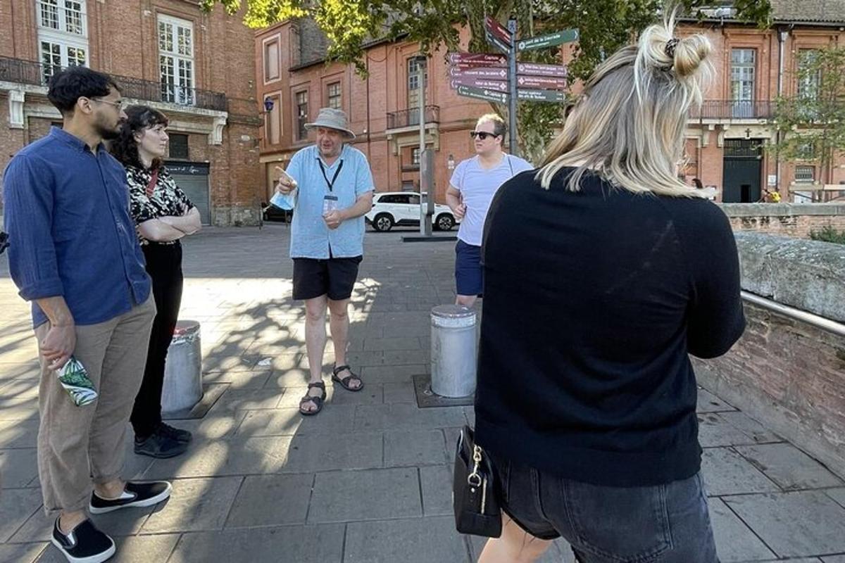 a group of people standing on a sidewalk