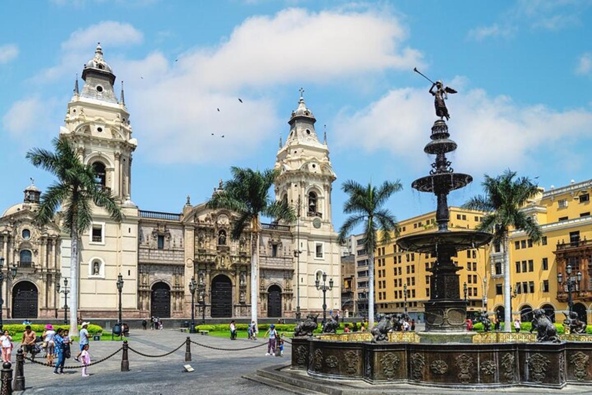 a city with a fountain in front of a building
