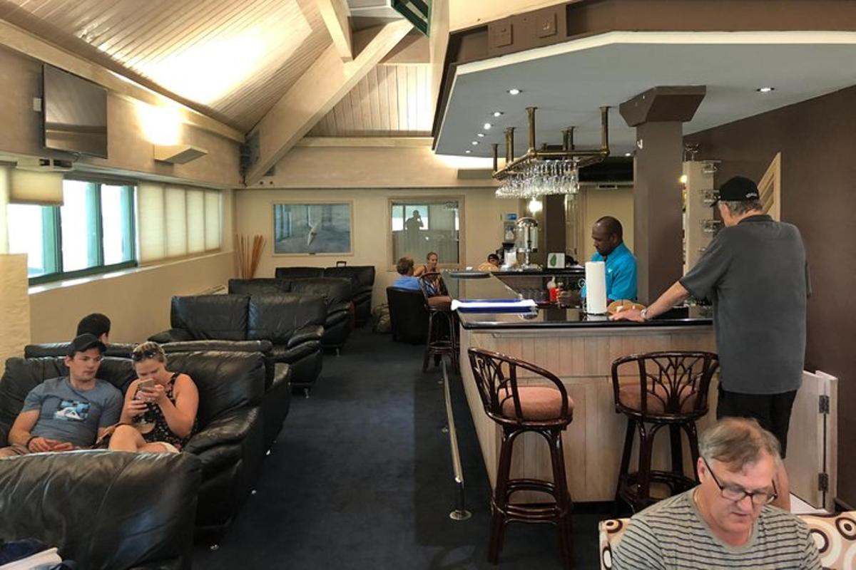 a man standing at a bar in a restaurant