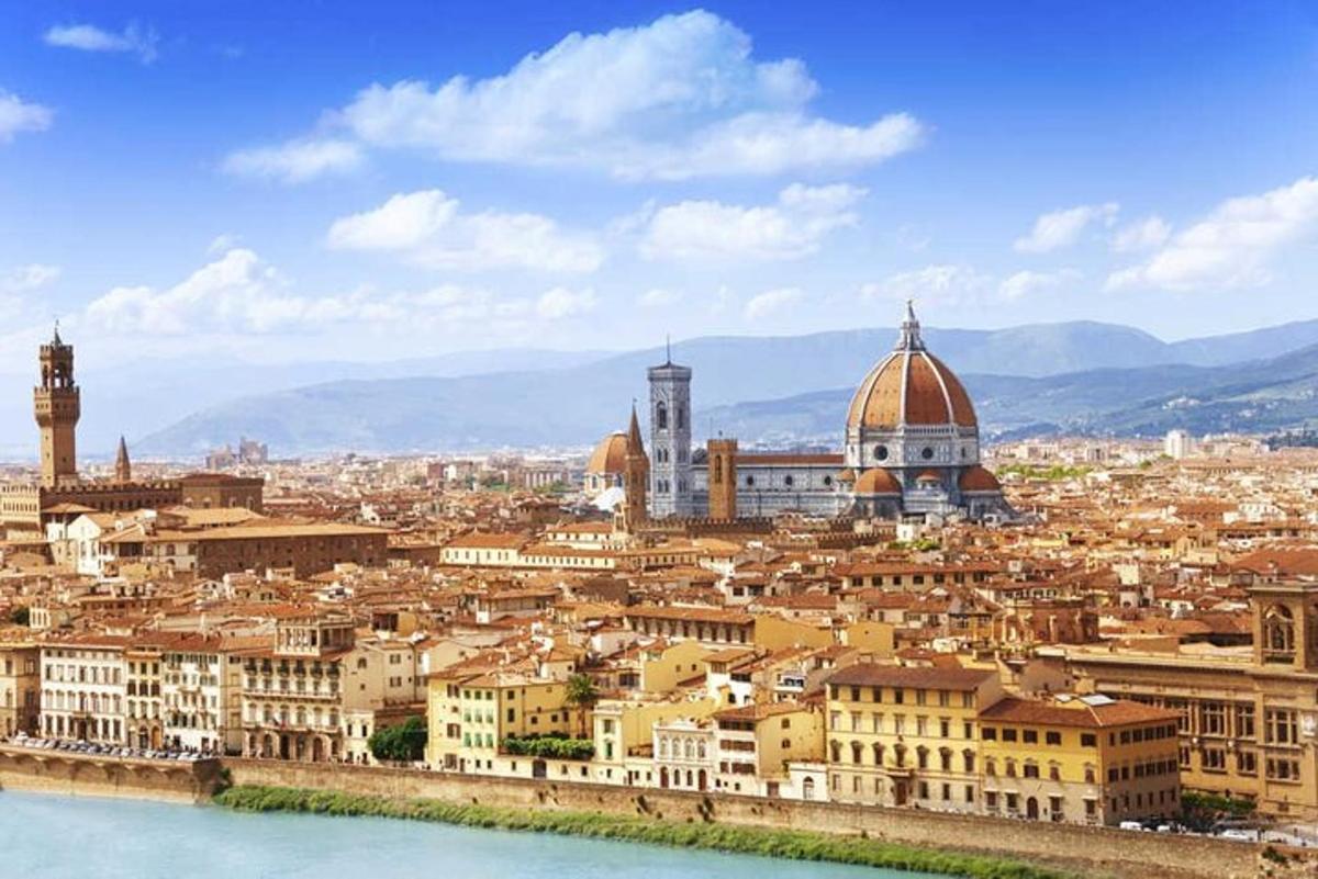 a view of a city with buildings and water