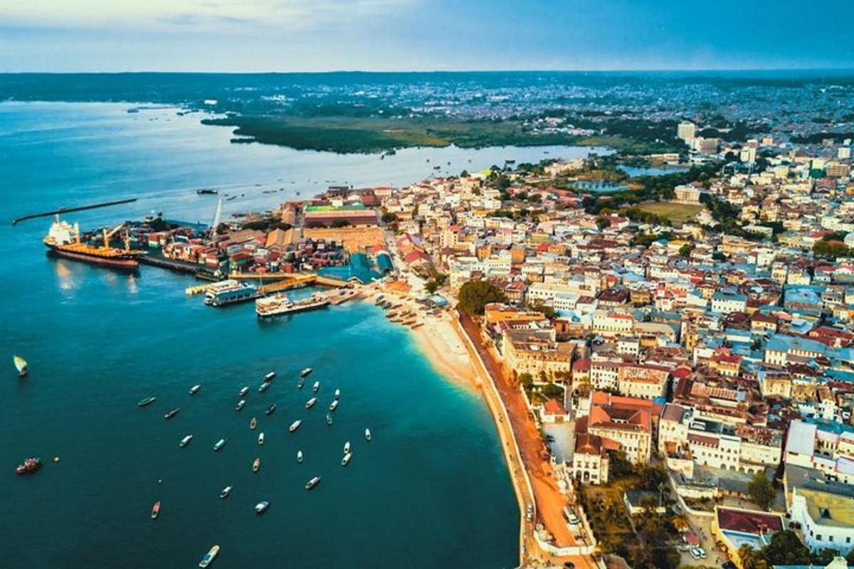 an aerial view of a city with boats in the water