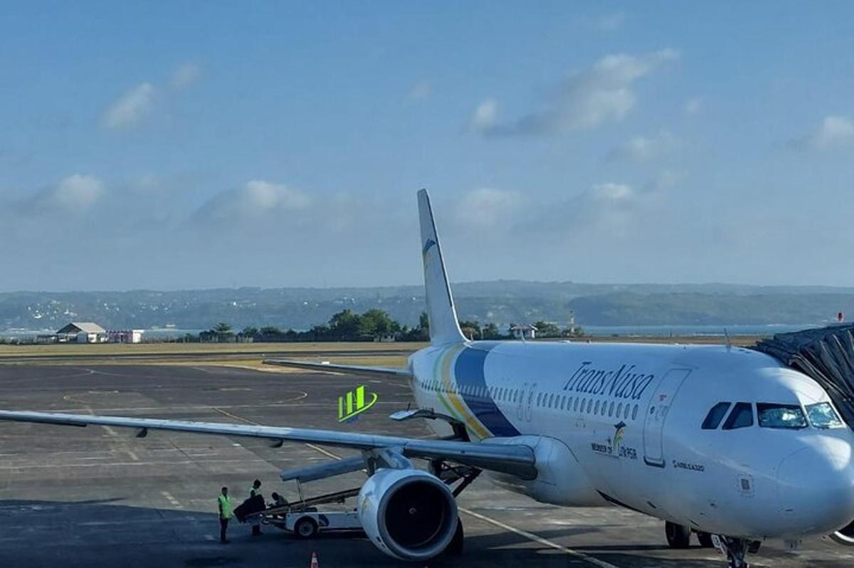 an airplane is parked on the runway at an airport
