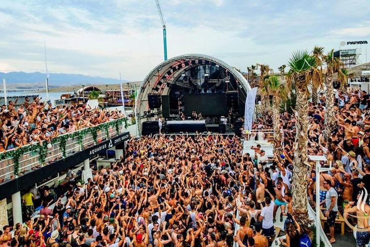 a large crowd of people in front of a concert