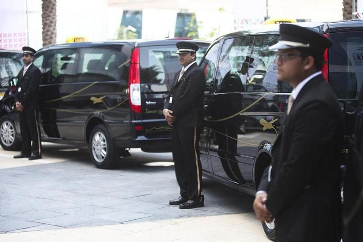 a group of men in uniform standing next to a van