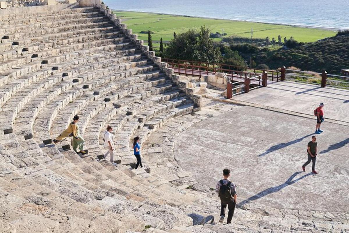 a group of people walking around an amphitheater