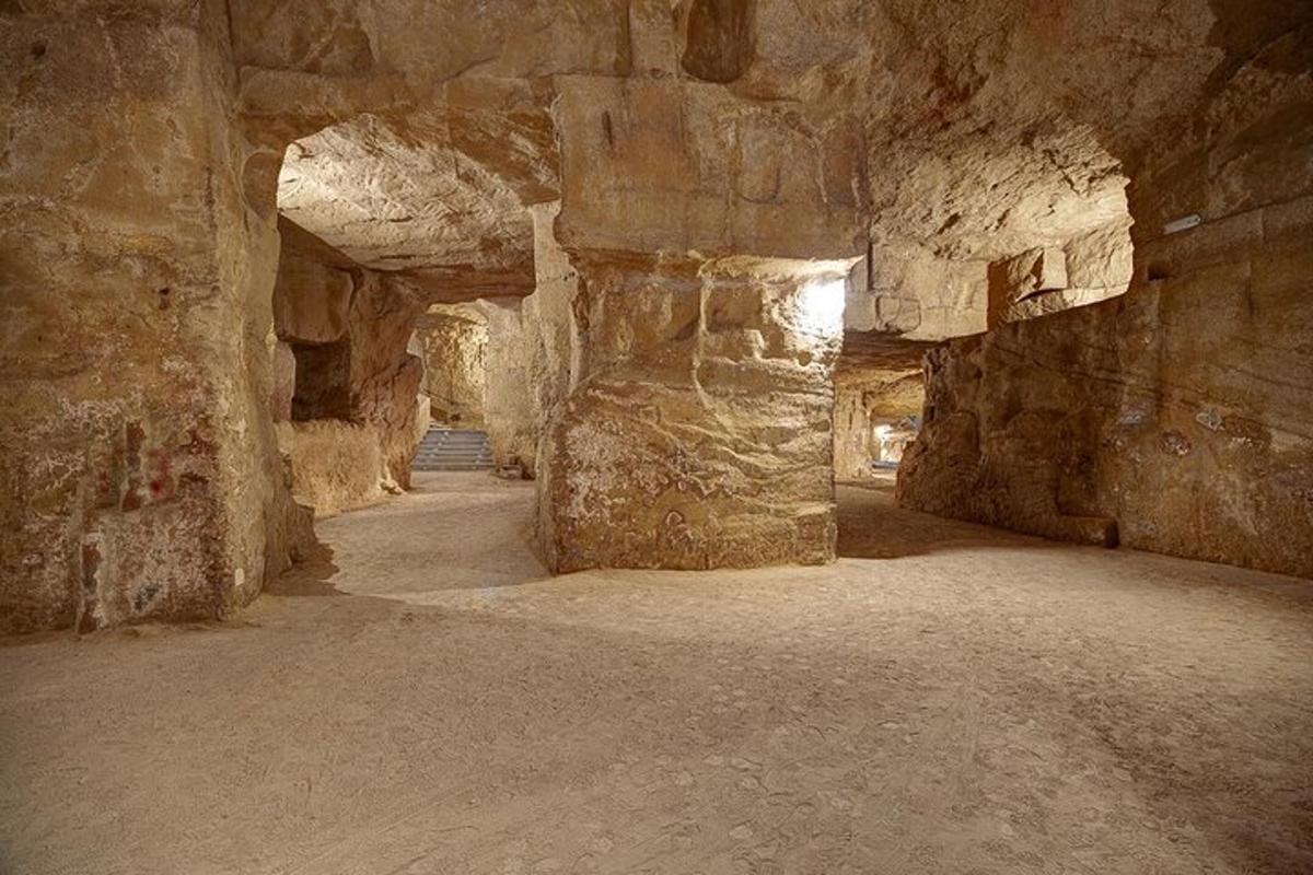 a cave with stone walls and a stone hallway