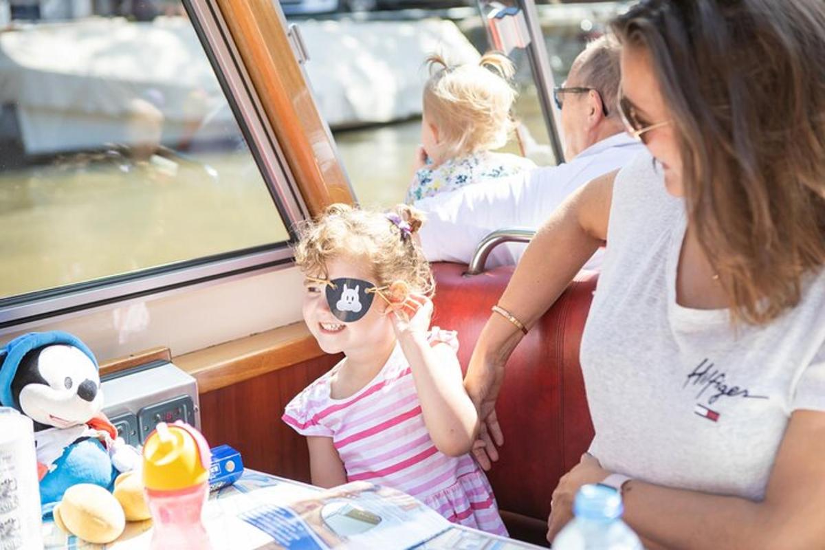 a little girl wearing sunglasses on a boat
