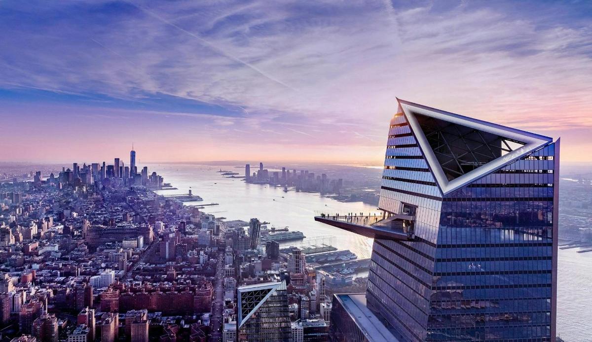 a view of a city with a tall building