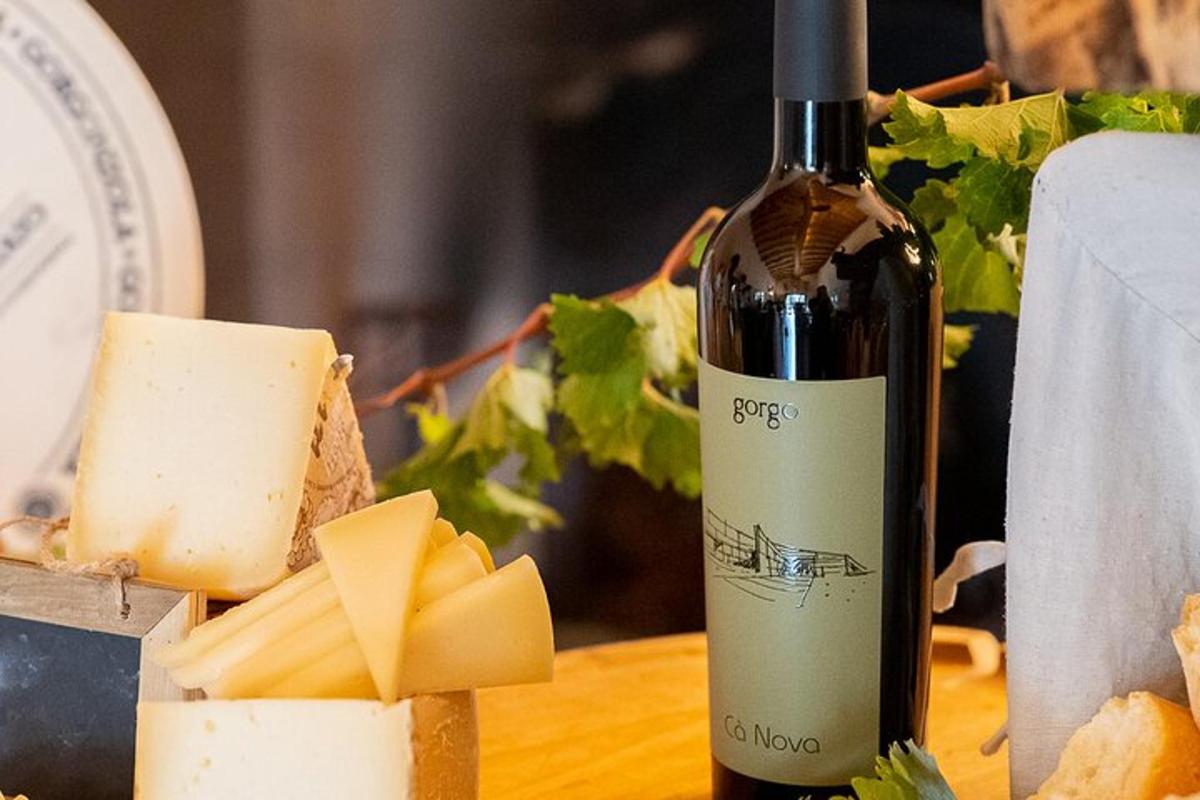 a bottle of wine and cheese on a table