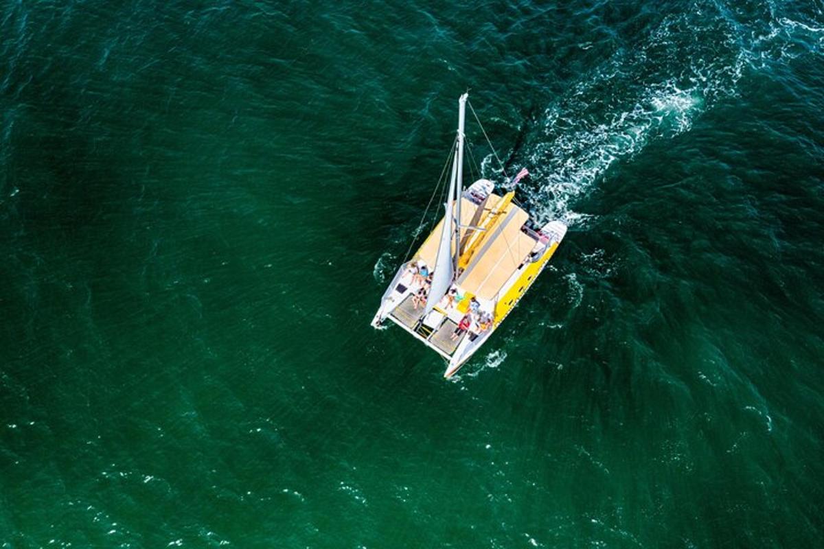 a yellow boat in the middle of the water