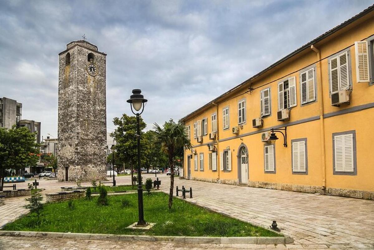 a building with a clock tower next to a street