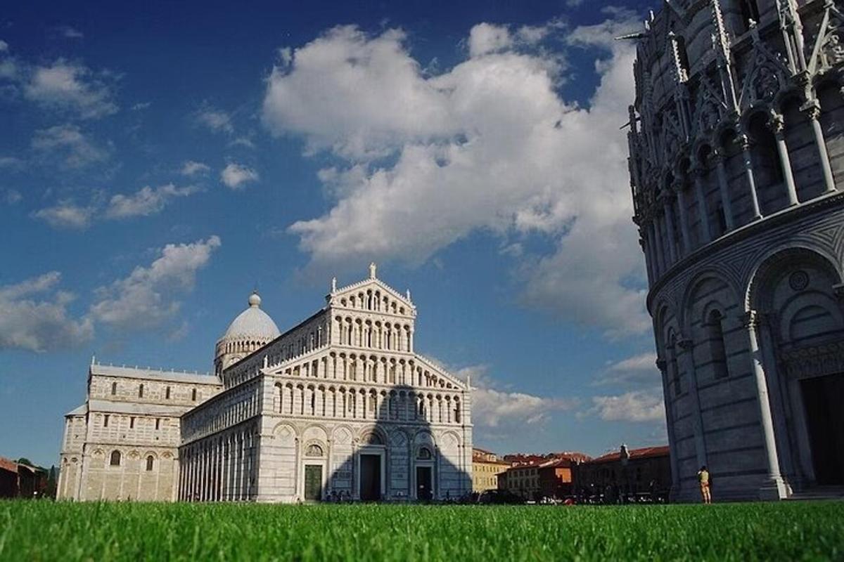 a large white building next to a tall building
