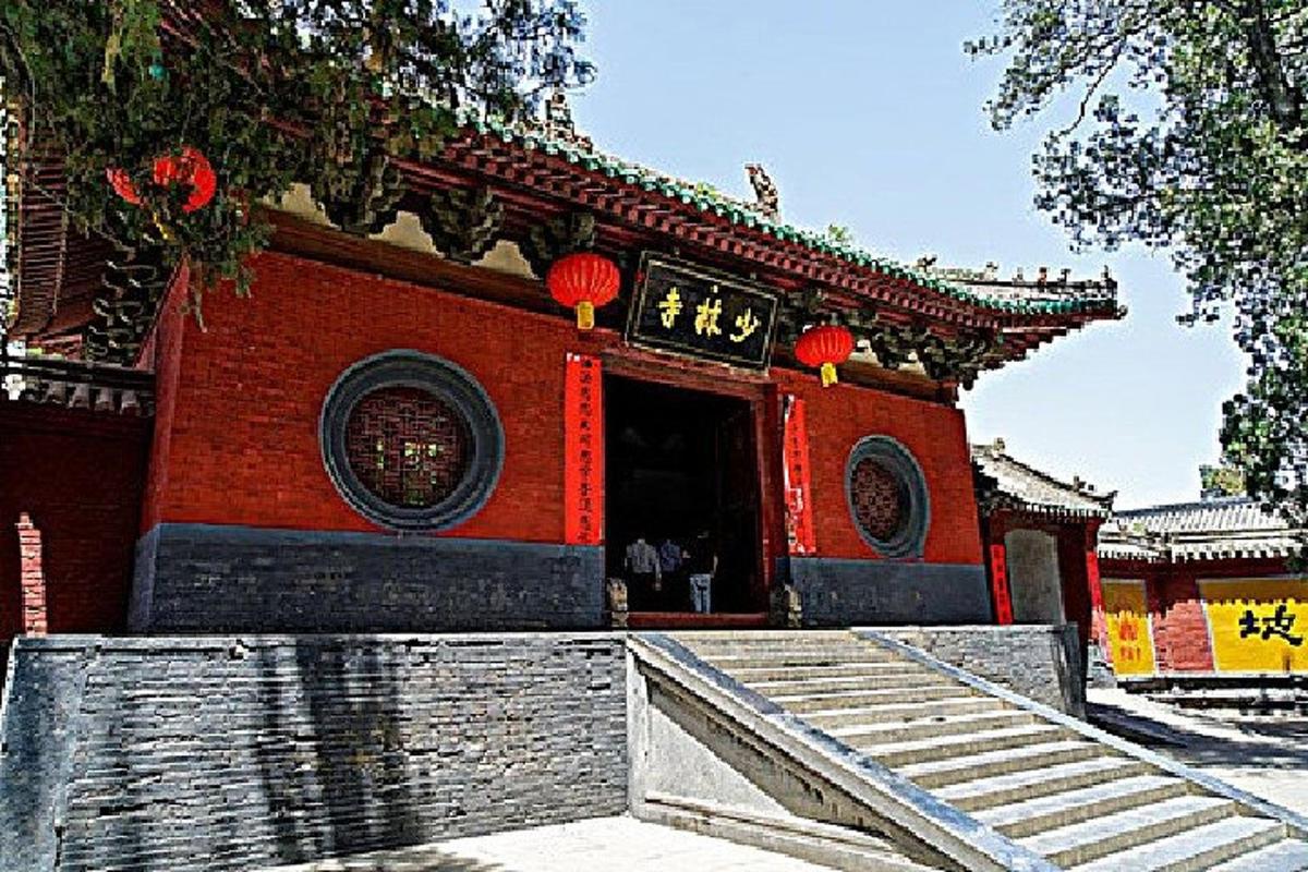 a small red building with chinese writing on it