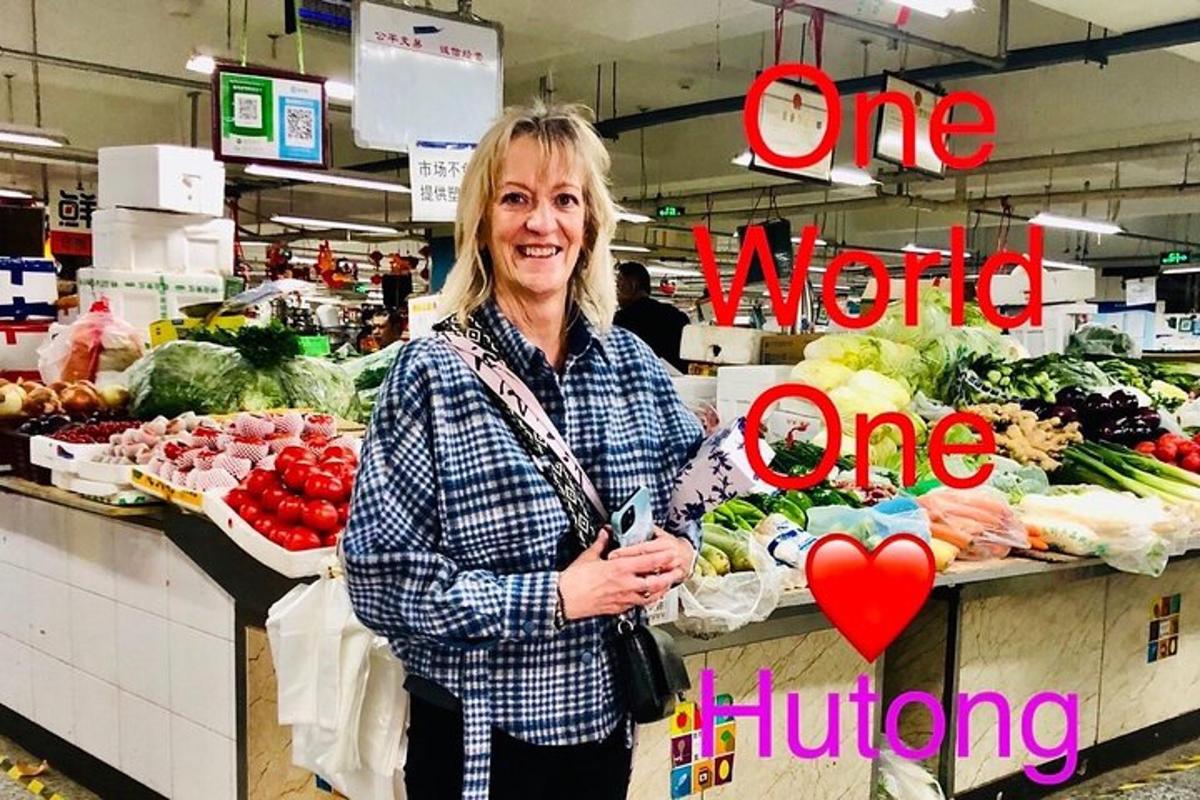 a woman standing in a grocery store holding a heart