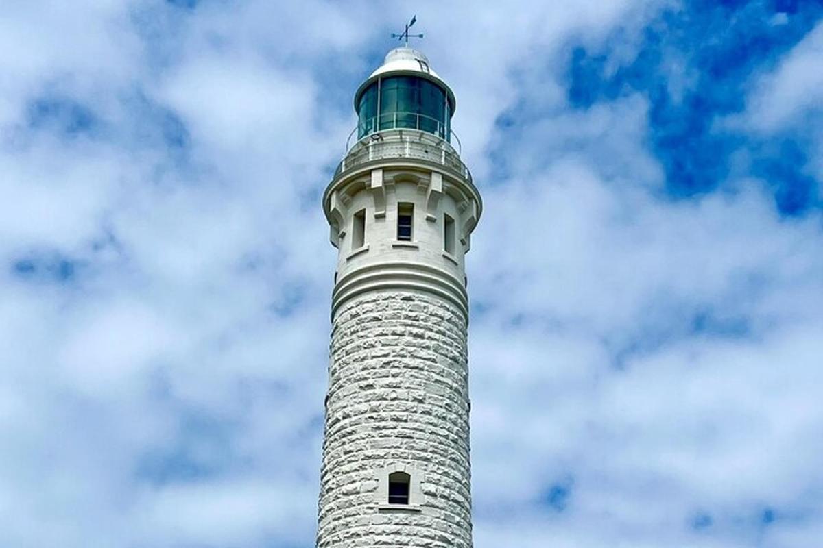 a tall lighthouse with a sky in the background