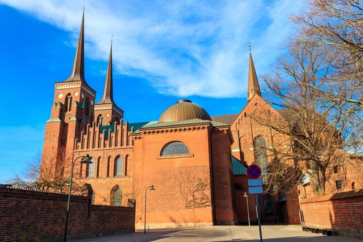 a large brick building with two towers on top of it