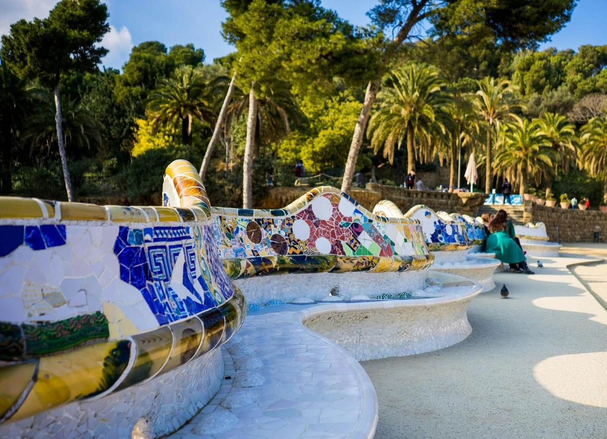 a row of benches with colorful tiles on them