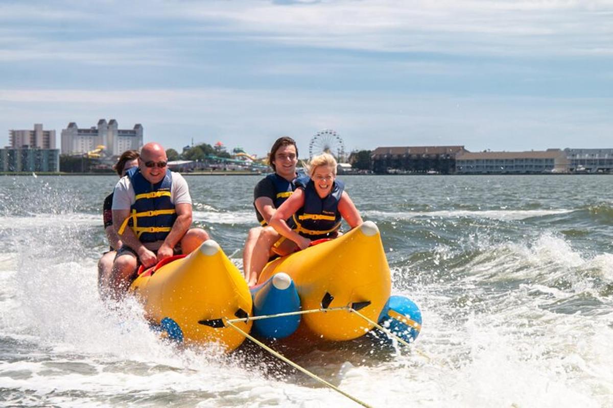a group of people riding on a yellow boat in the water