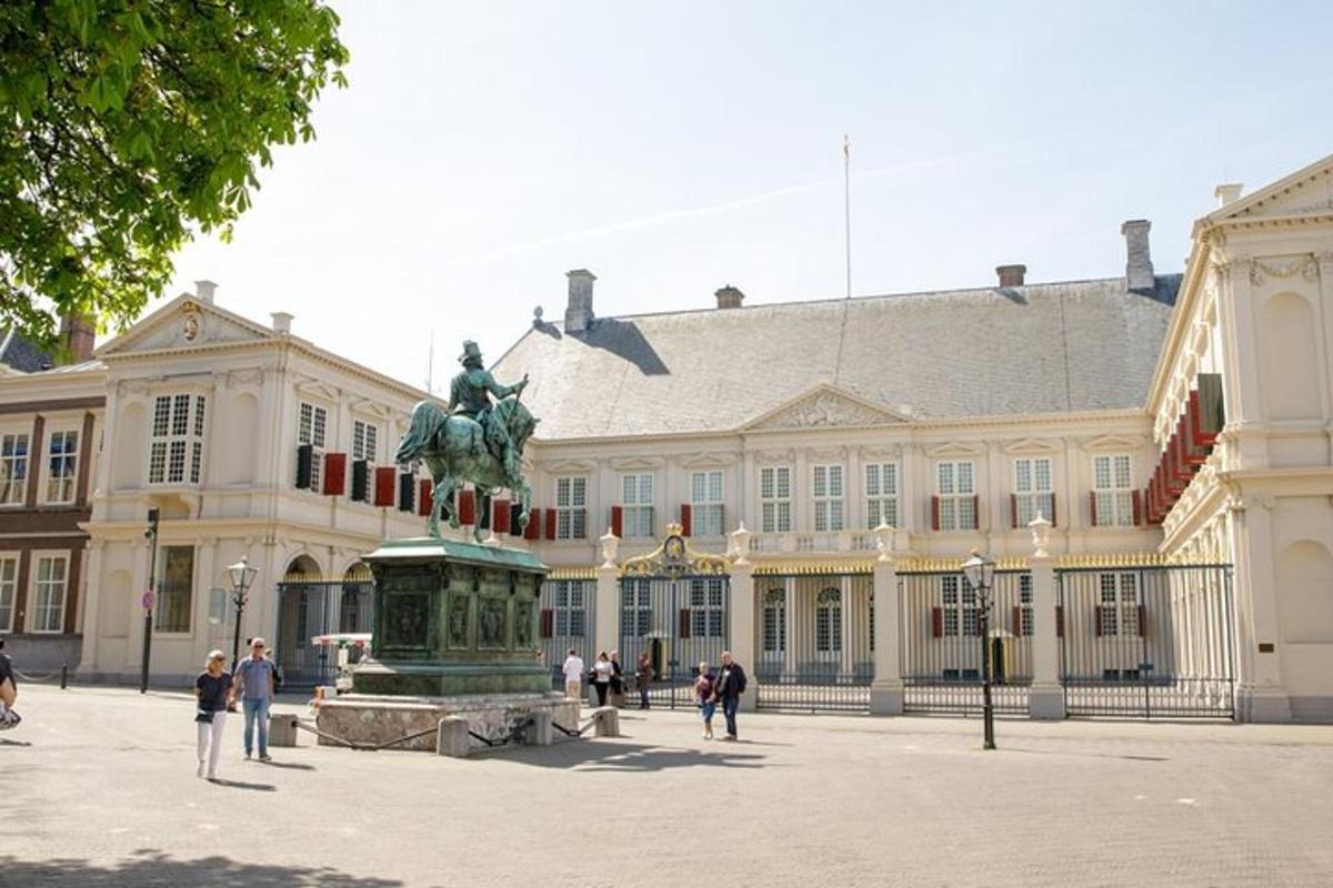 a large building with a statue in front of it