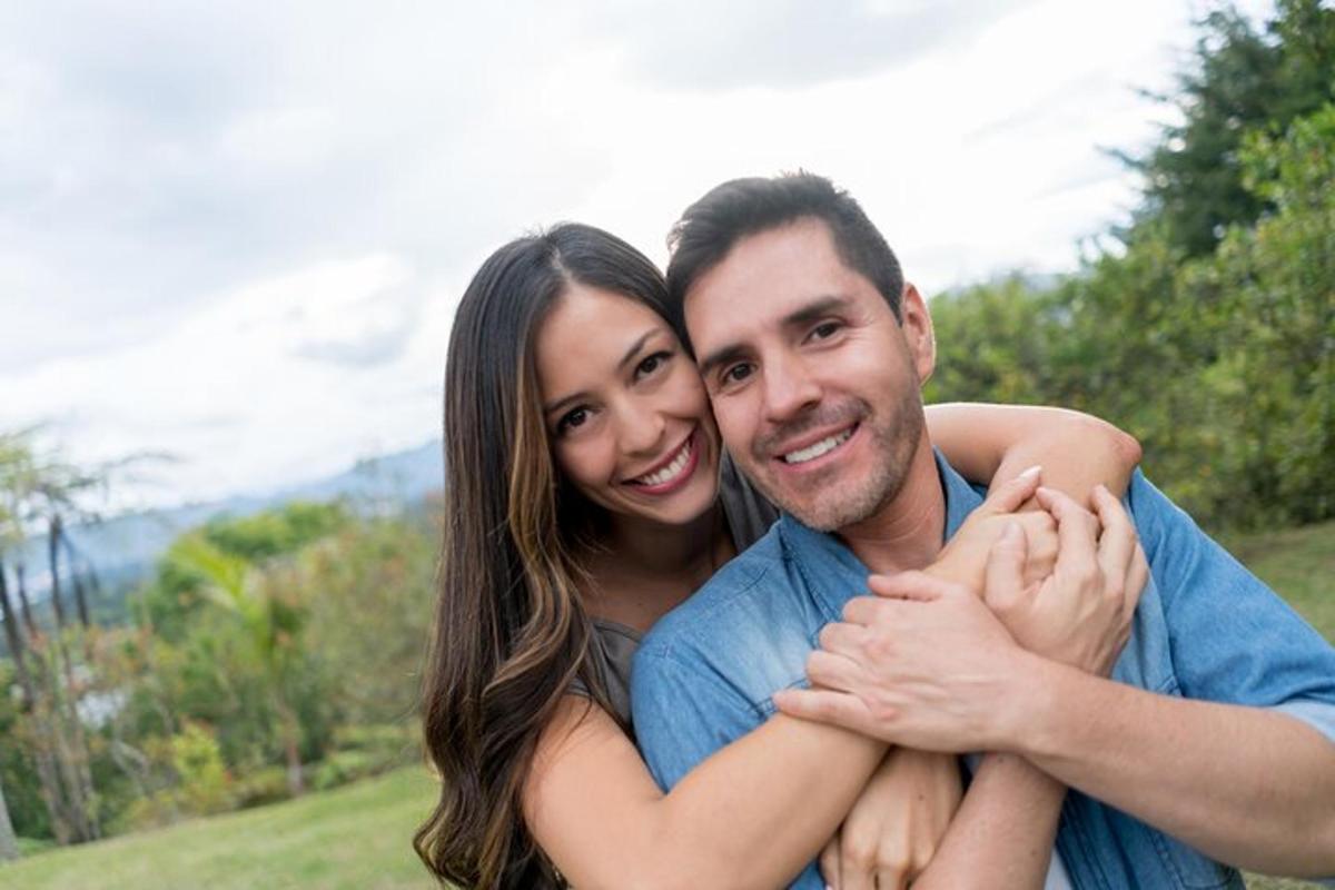 a man and a woman posing for a picture