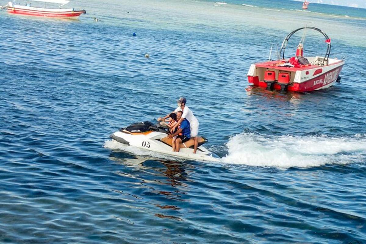 a man and a woman on a boat in the water