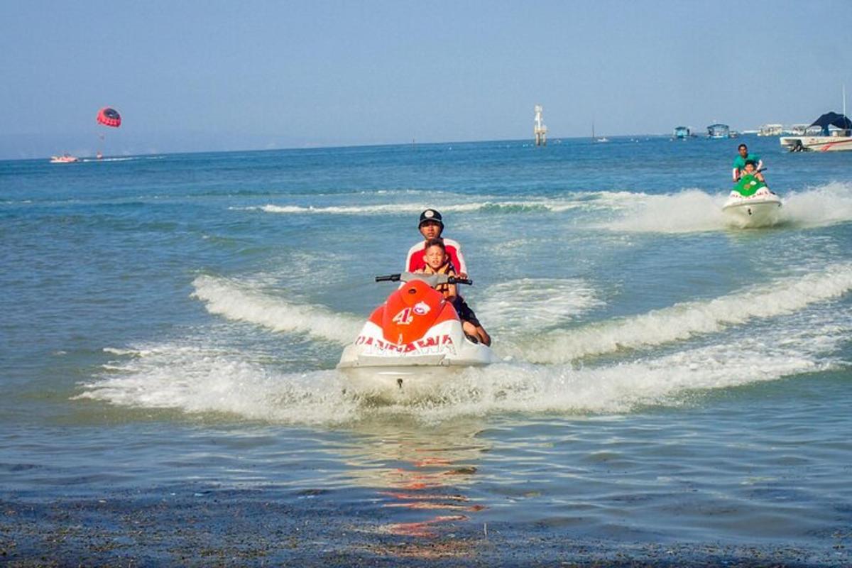 two people riding on a boat in the water