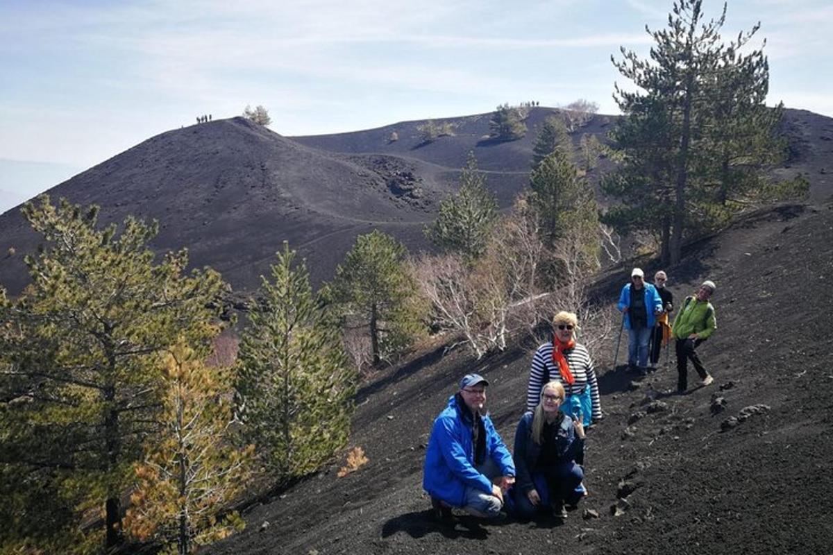 a group of people walking up a hill