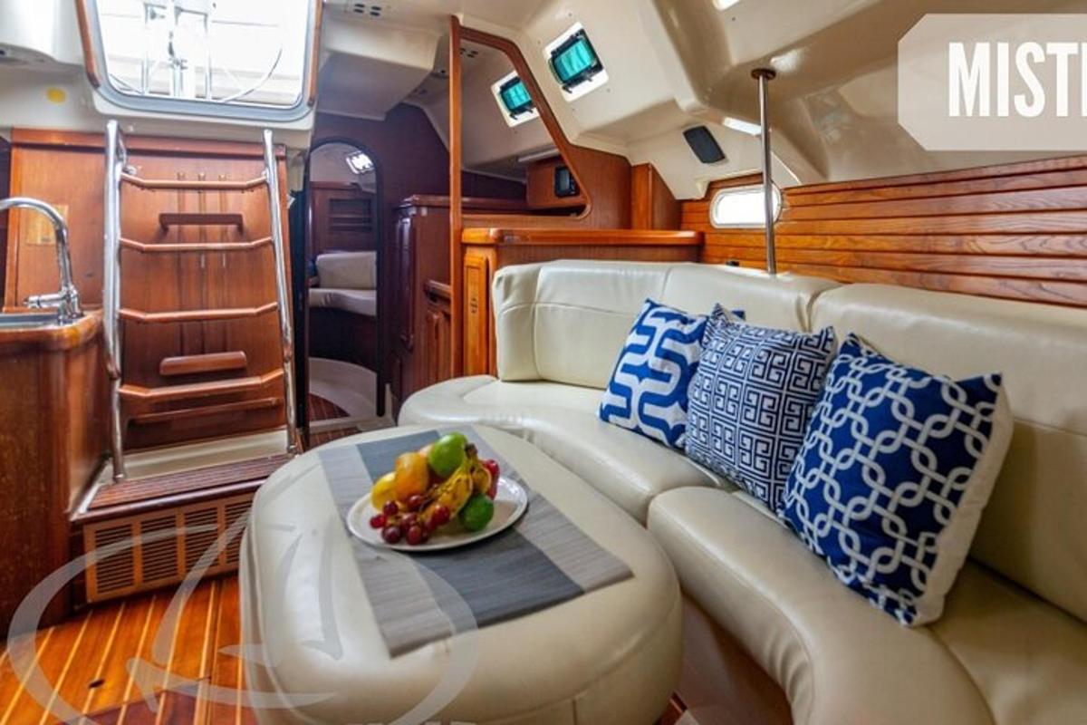 a living room with a couch and a plate of fruit
