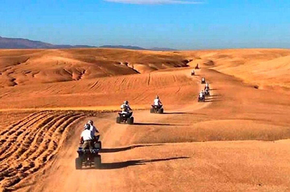 a group of people riding motorcycles in the desert