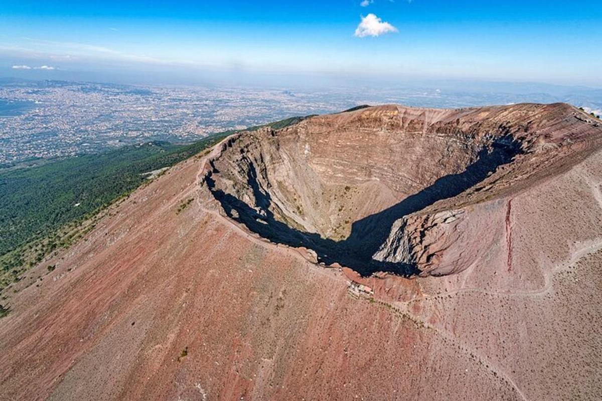 an aerial view of a mountain with a city