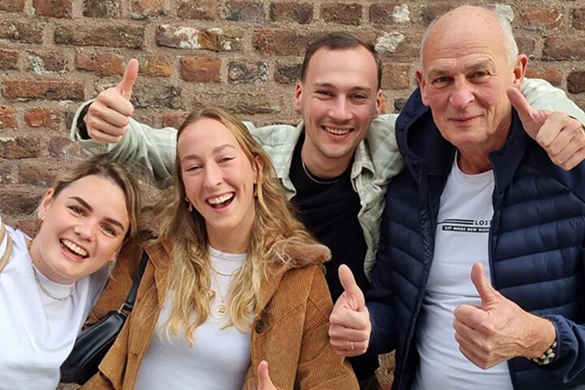 a group of three people giving thumbs up