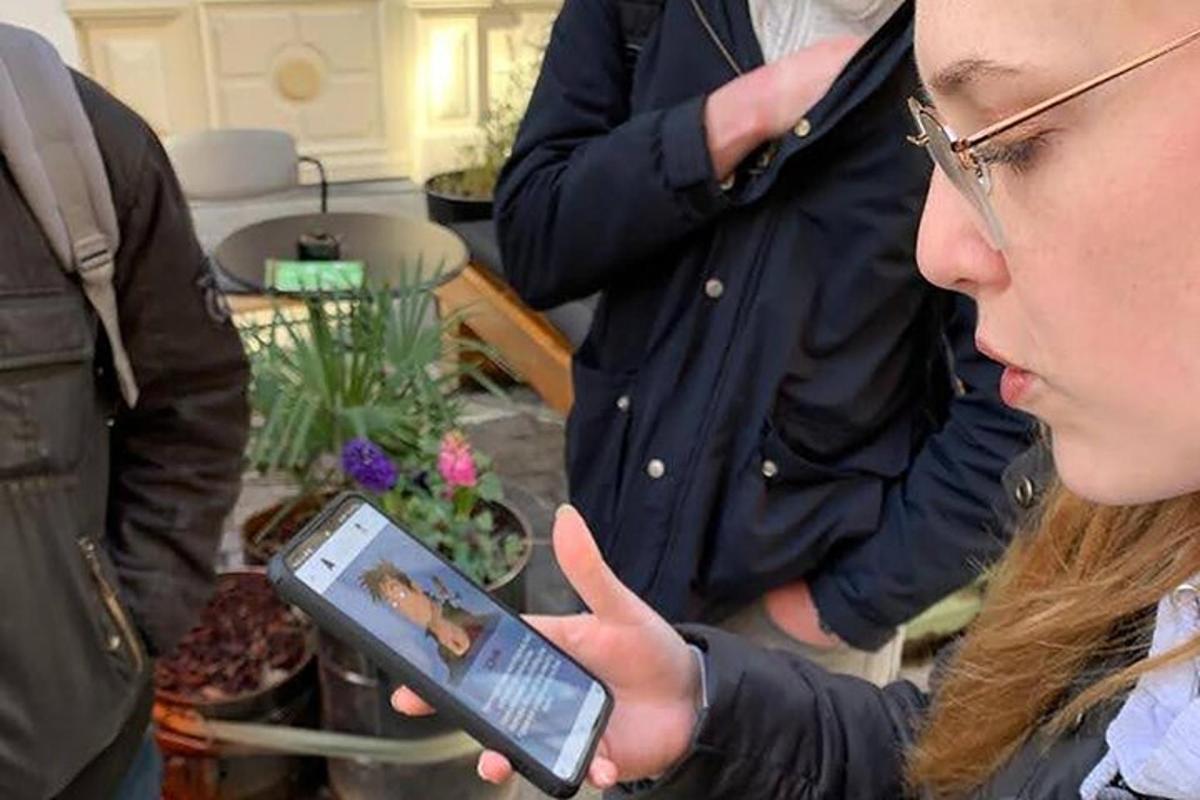 a woman is looking at a cell phone
