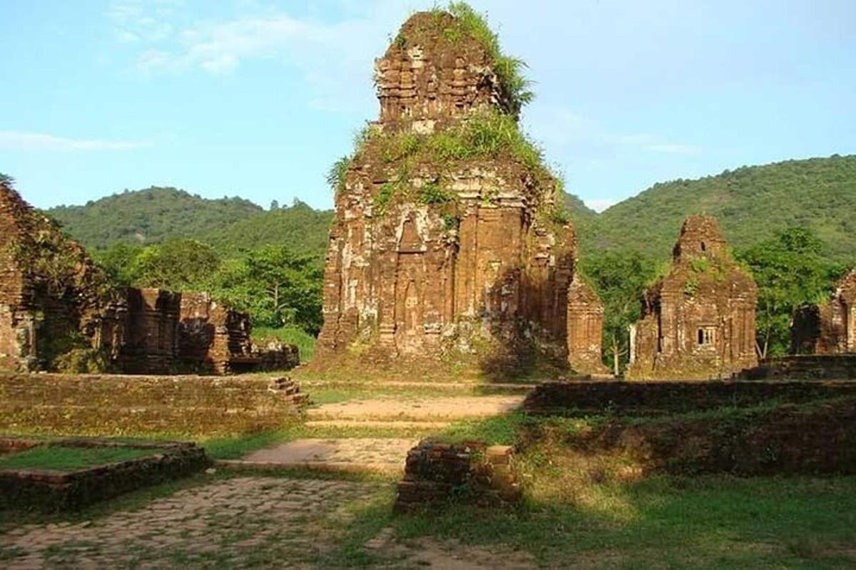 a large stone building with grass on top of it
