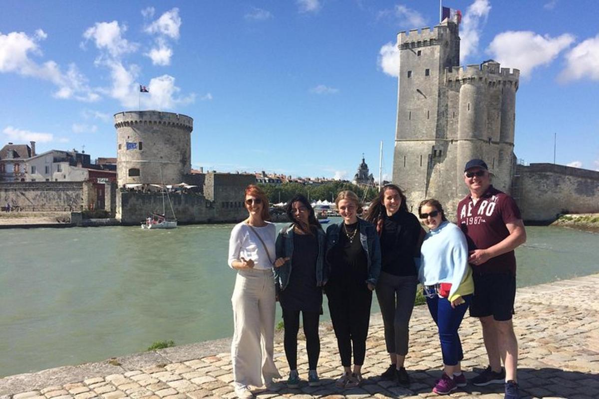 a group of people standing in front of a castle