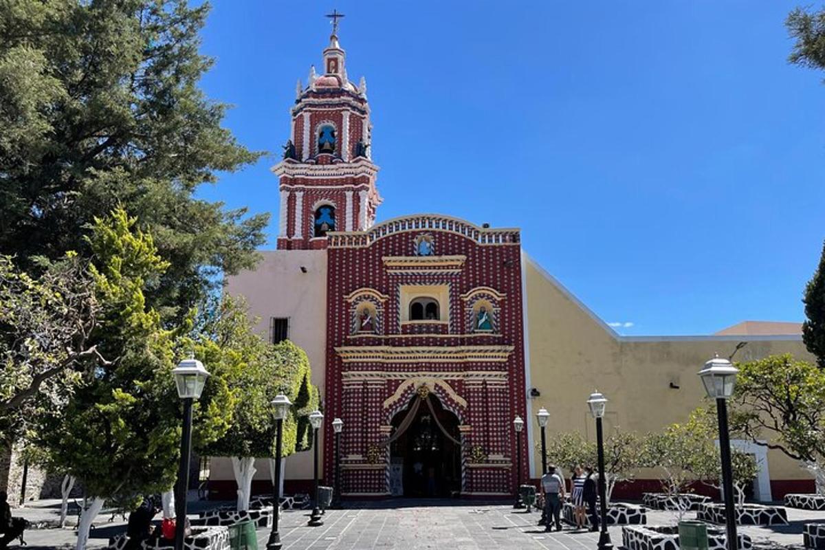 a church with a large brick building with a tower