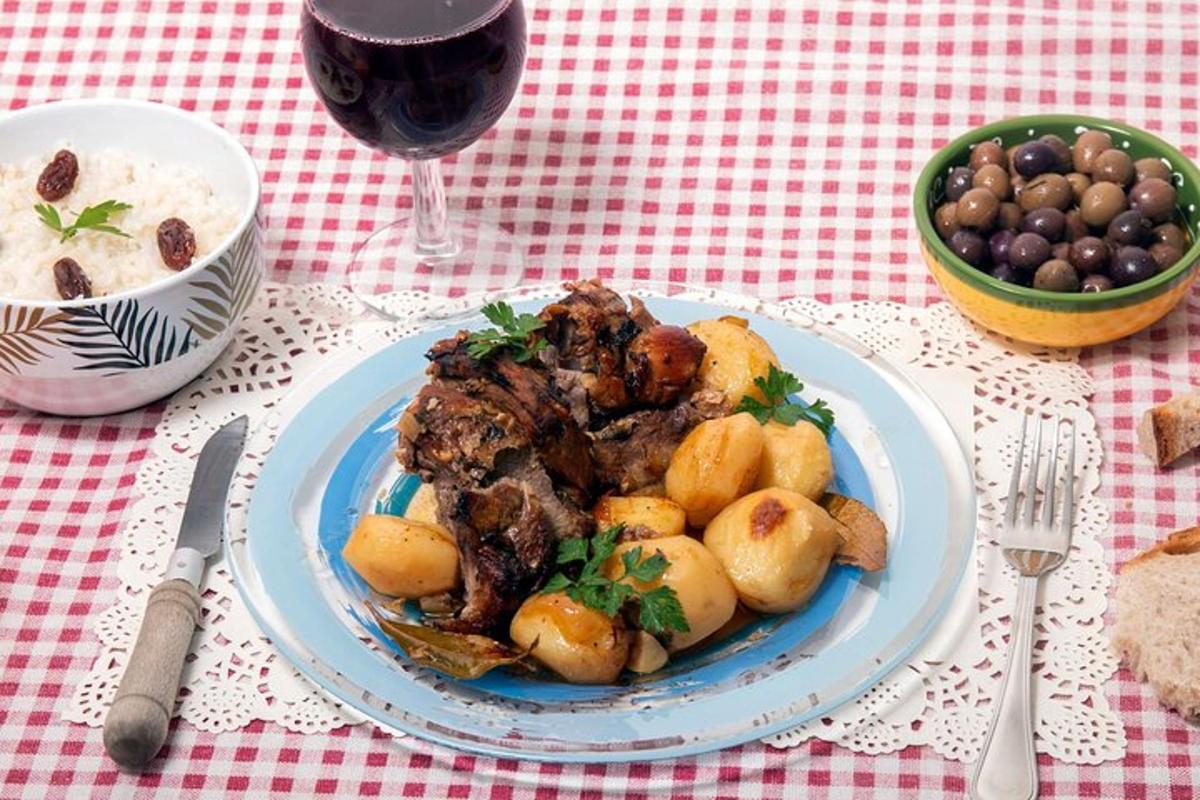 a plate of food on a table with a glass of wine