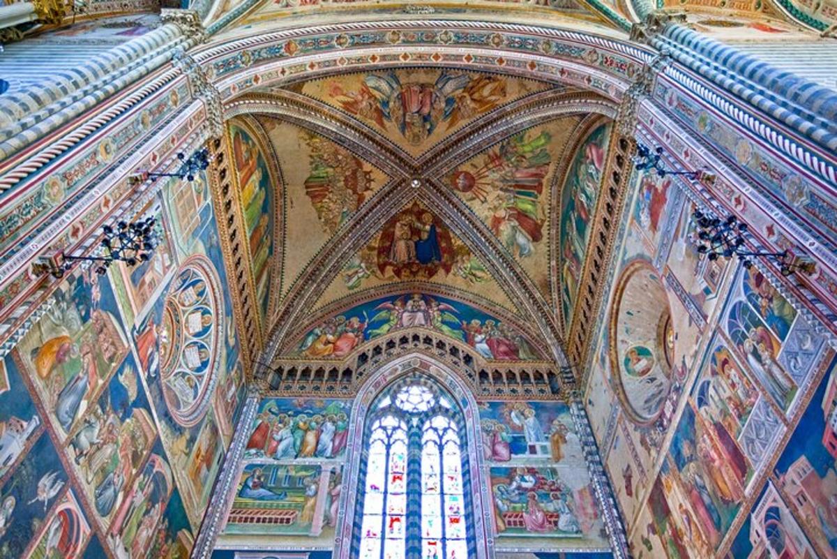 a room with paintings on the ceilings of a church