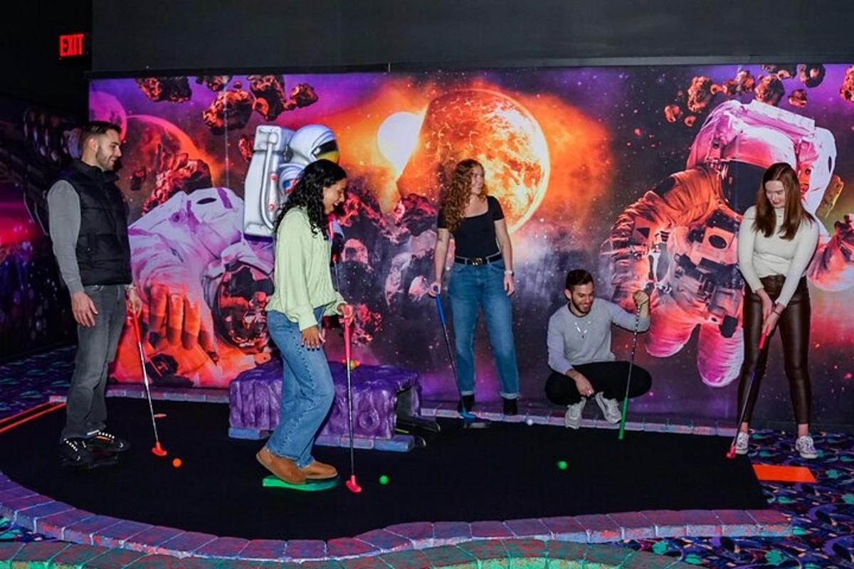 a group of people playing golf in front of a mural