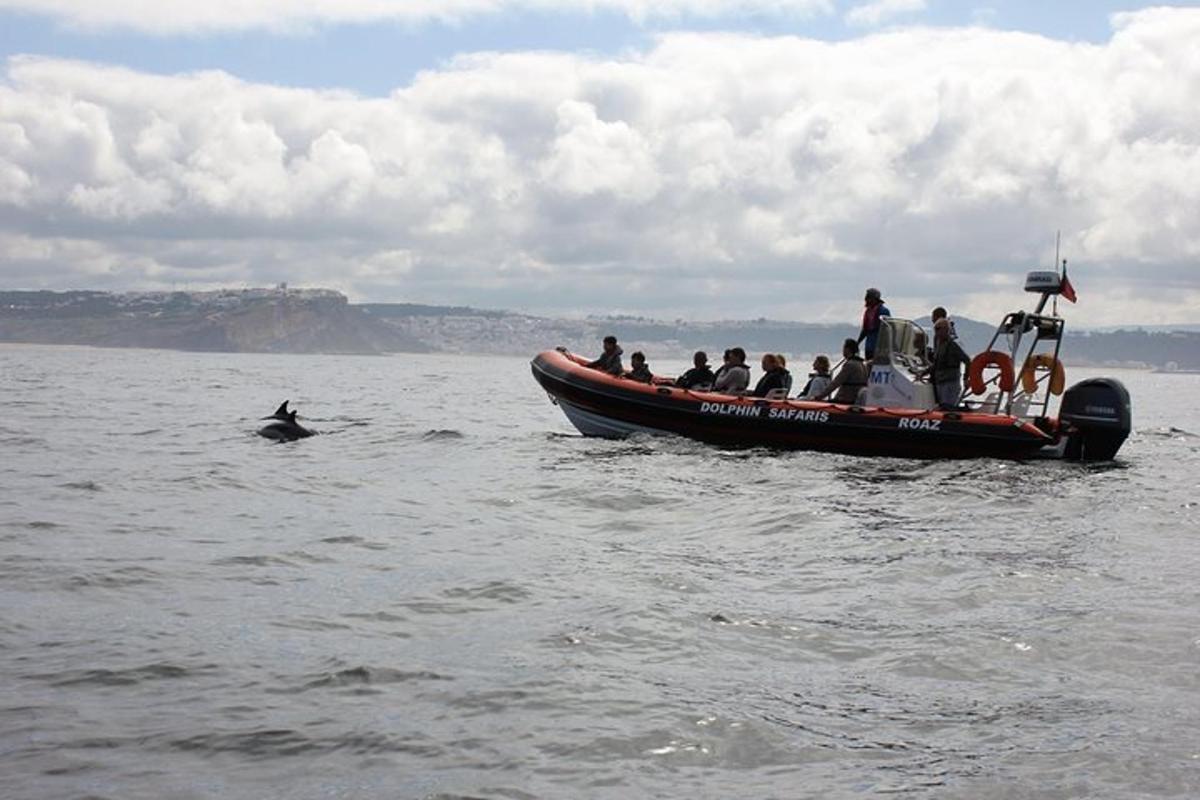 a group of people on a boat in the water