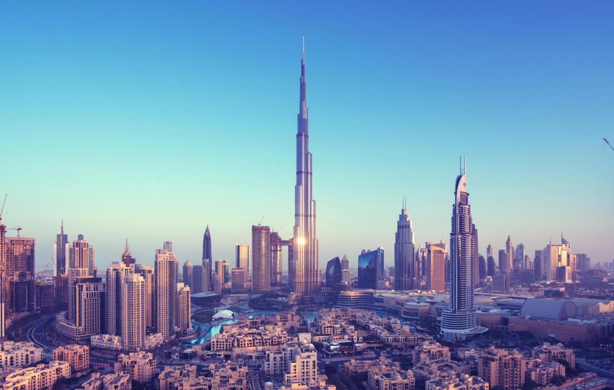 a view of a large city with a tall skyscraper
