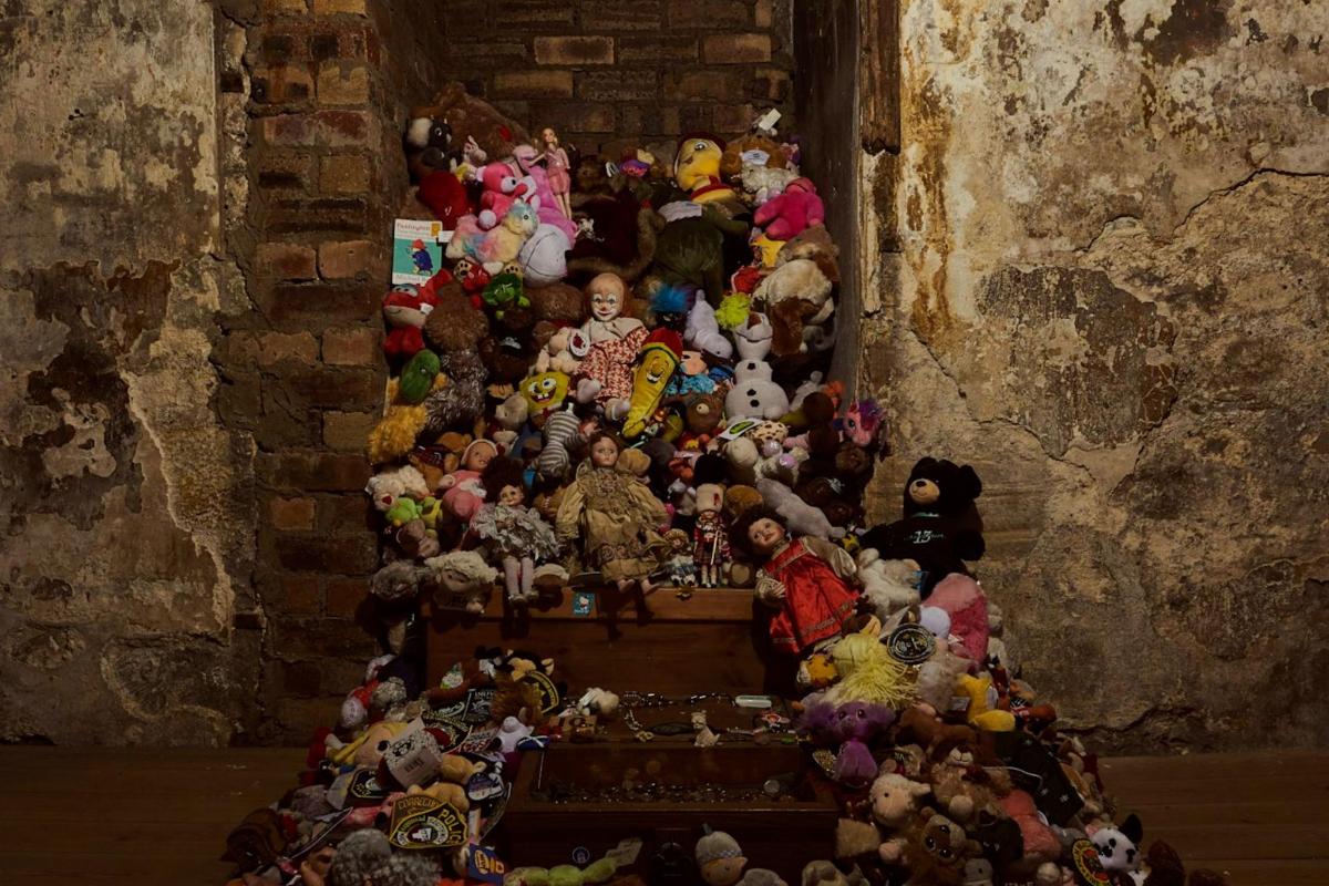 a large group of stuffed animals in a room