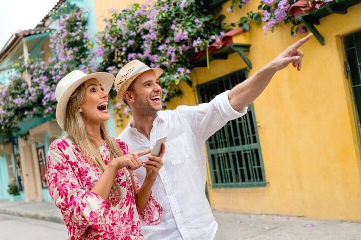 moški in ženska gledata v mobilni telefon