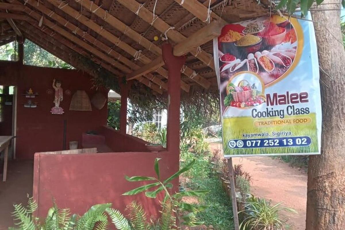 a sign for a catering class on the side of a building