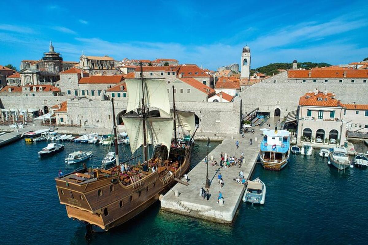 a boat is docked in the water near a city