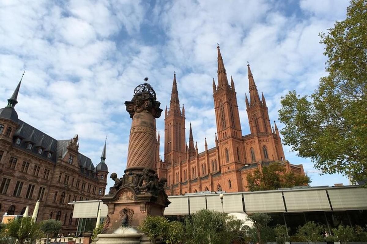 a large building with a clock tower in front of it