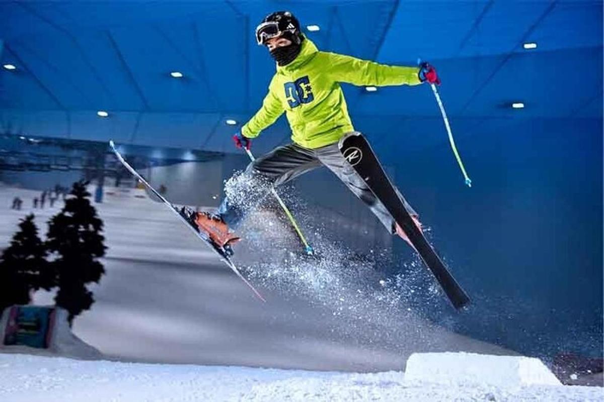 a man flying through the air while riding skis